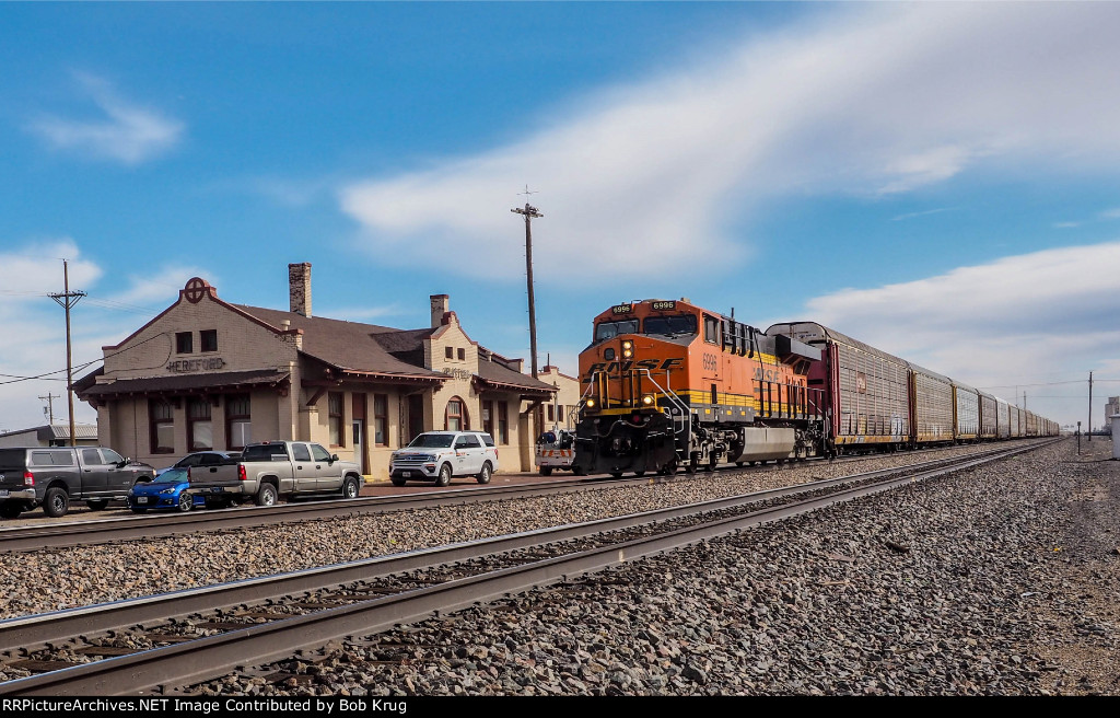 BNSF 6996 leads westbound Autoracks past the ex-ATSF depot in Hereford, TX
